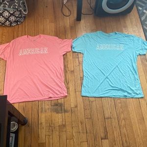 Blue and pink American University t shirts
